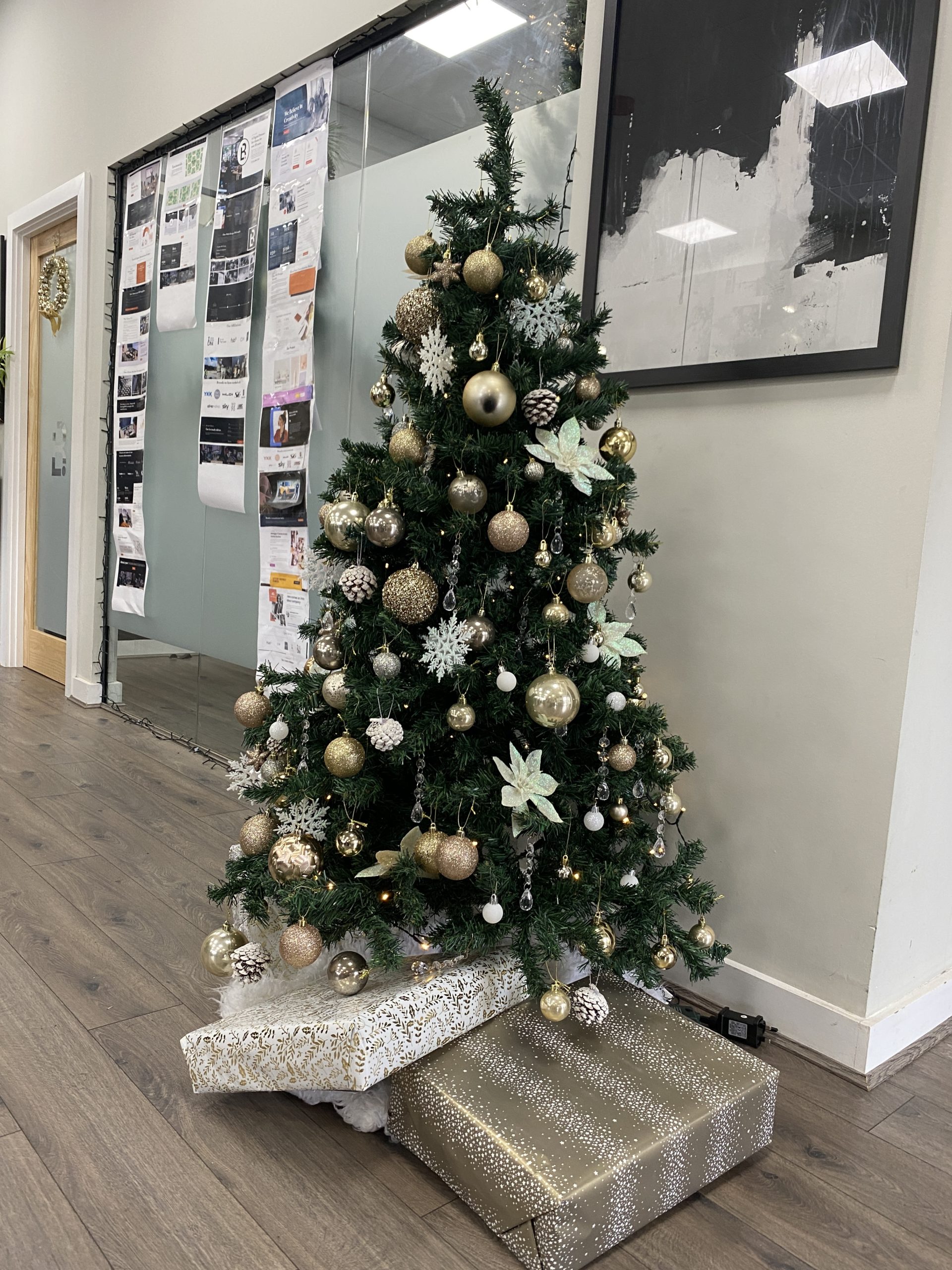 IMG_5232 Christmas Tree with wrapped up presents in the Blue Whale Media office